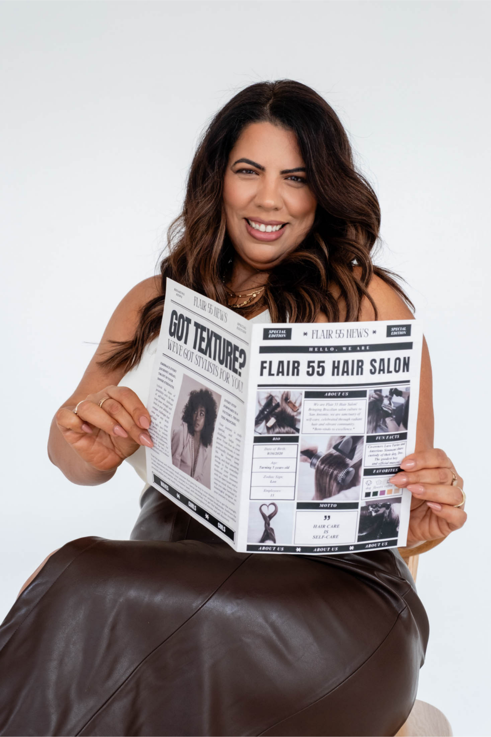 Picture of a Brazilian woman holding a newspaper