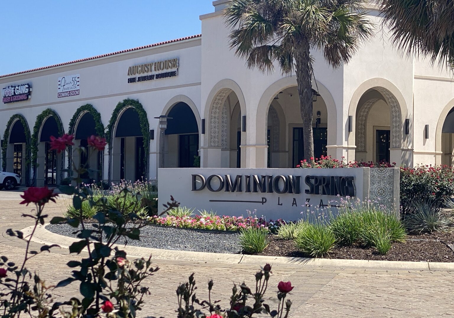 Image of the Dominion Springs Plaza with the Flair 55 Hair Salon coming soon sign.